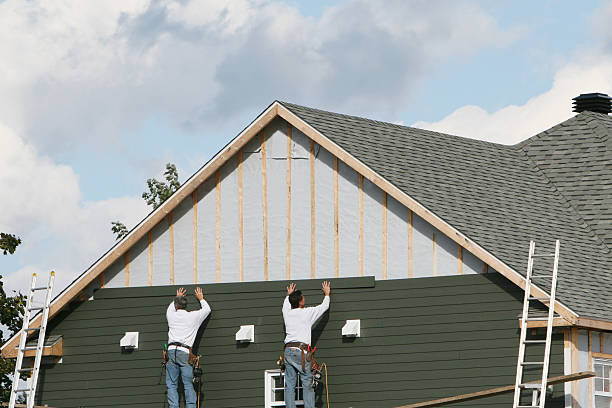 Professional Storm Damage Siding Repair technician working in Imler, PA